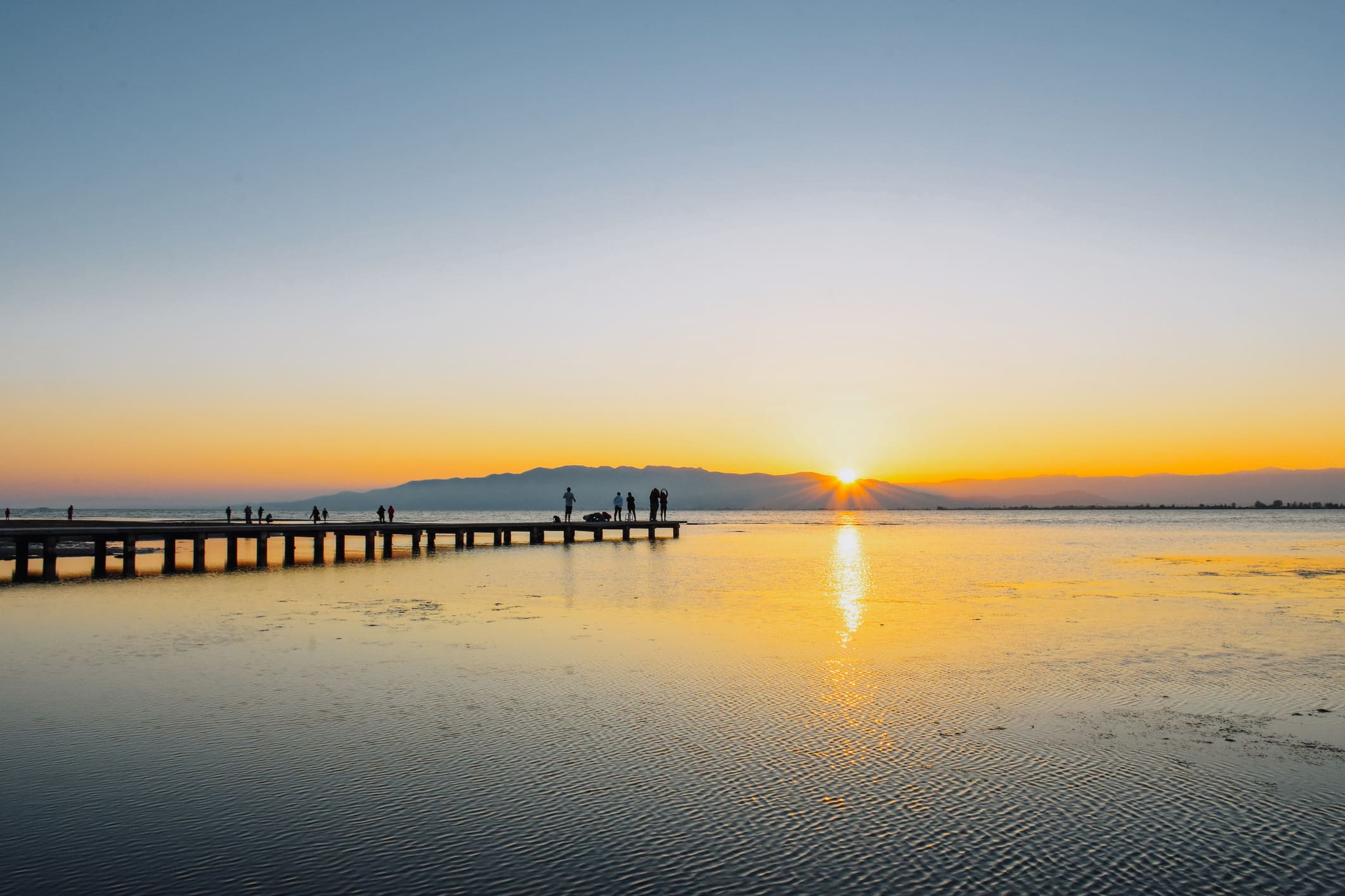 Posta de sol des de l’embarcador de la platja del Trabucador