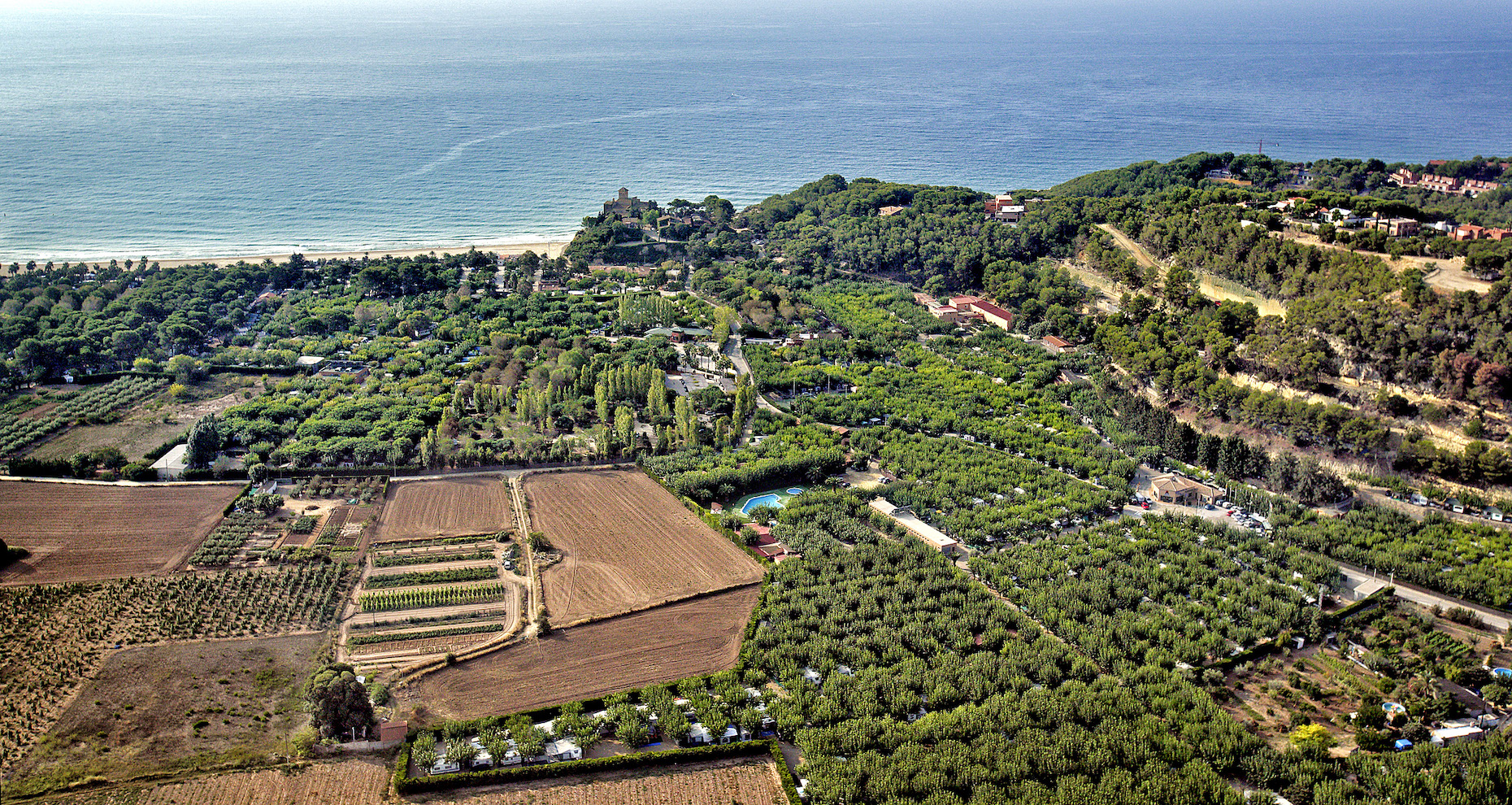 A la desembocadura del Gaià, entre la platja i camps de conreu hi ha el càmping Tamarit Beach Resort, fundat el 1961